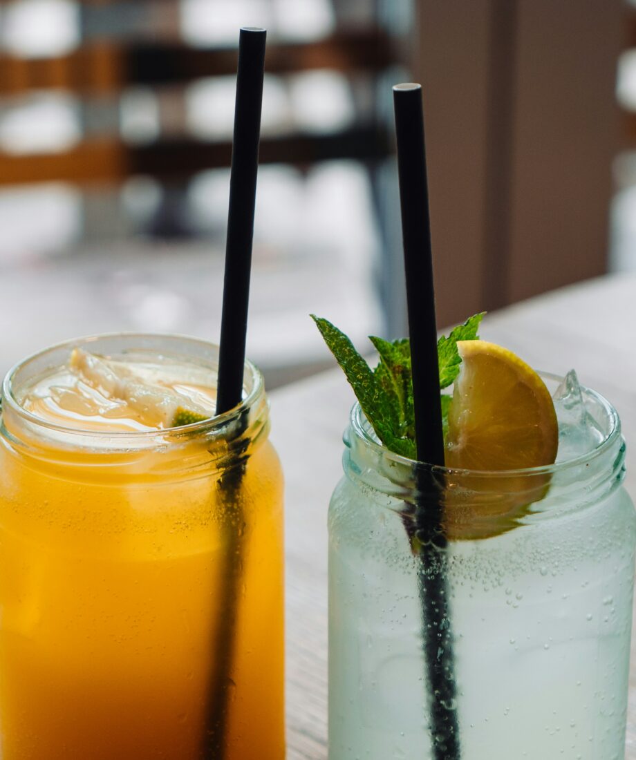 two glasses with non-alcoholic drinks inside them.
